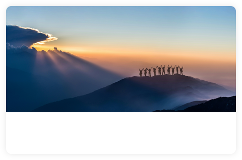 A team looking towards a mountain horizon